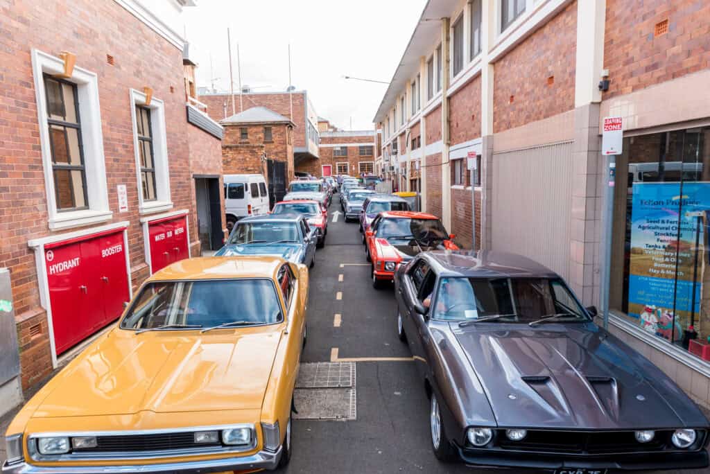 Cars parked two deep in Alley protesting carparking fines